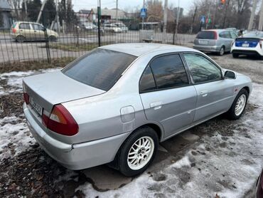 Mitsubishi: Mitsubishi Lancer: 1997 г., 1.5 л, Вариатор, Бензин, Седан