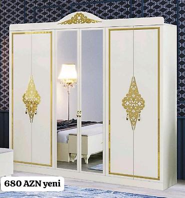 kombi şkaf: Ağ rəngdə, klassik üslubda 4 qapılı geyim dolabı. Ön hissədə iki ədəd — 1