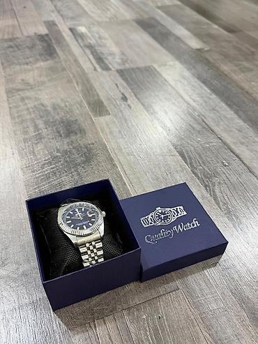 saatlar type 0: Metall kəmərli kişi qol saatı – Rolex Watch” qutusunda. Maya deyerine — 1