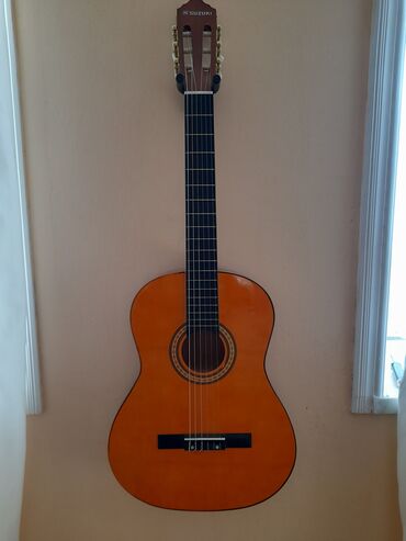 İdman və hobbi: 150 manata satılır 2 ayin gitarsıdır az işlənib reyal alıcı narahat