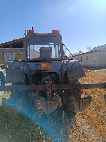 Унаа: Трактор колесный с кабиной, с навесным плугом Описание: - Колесный — 3