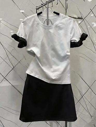 Kompleti: Dve-delni komplet: majica + mini suknja 2 komada po cenini od 3800 — 1