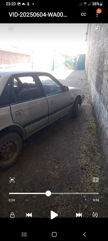 мазда 6 атенза: Седан Mazda 626 серебристого цвета, представленный на фотографиях