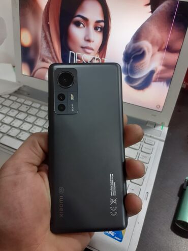 Xiaomi: Xiaomi Mi 12X, 128 ГБ, цвет - Черный, 
 Сенсорный, Отпечаток пальца, Беспроводная зарядка