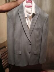 Köynəklər: Kişi kostyumu – zolaqlı klassik model - Rəng: boz, incə ağ şaquli