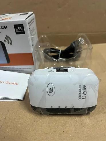 Modemi, ruteri i mrežni uređaji: Wireless‑N WiFi Repeater Opis: - Pojačivač/bežični repetitor koji — 5