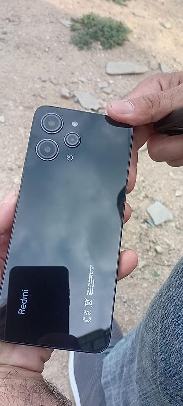 xiaomi redmi pad: Redmi smartfon - Arxa panel: parlaq qara səth, “Redmi” loqosu və CE — 1