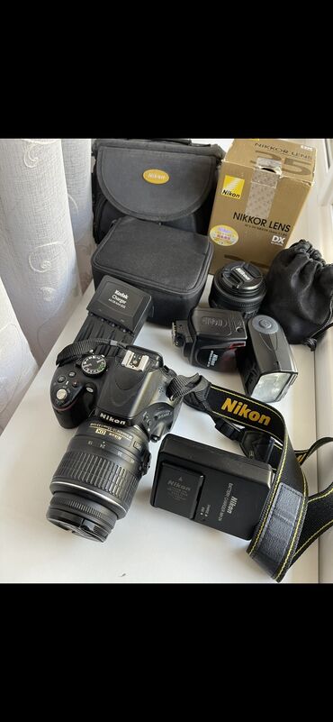 Продаю фотоаппарат Nikon d5100(20.000 с),объектив 35 mm (12.000