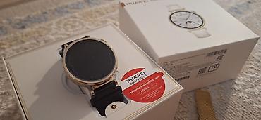 qi̇zi̇l: Huawei Watch GT 4 (41 mm) – qızılı rəngli korpus, dairəvi dizayn — 2