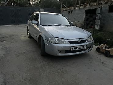 мото зонтик: Mazda Familia: 1999 г., 1.5 л, Автомат, Бензин, Универсал — 6