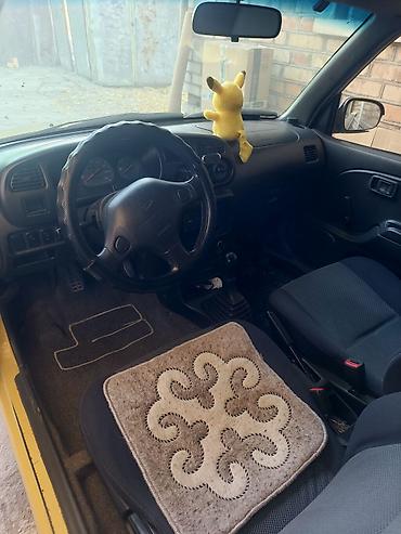 авто ижара: Daihatsu Cuore: 2001 г., 0.7 л, Кол менен иштөөчү, Бензин, Хетчбек — 3