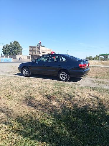 дайхатсу мира: Toyota Carina E: 1996 г., Механика, Бензин, Седан — 3