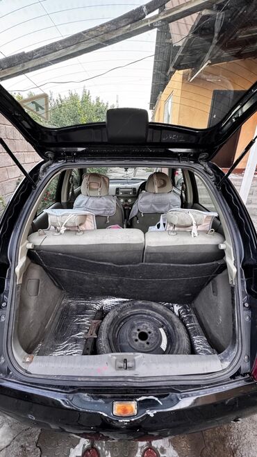 антена на авто: Nissan Micra (кузов K12), хэтчбек 5 дв., правый руль. Черный цвет