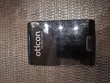 koga sta: Oticon Go Pro – iza-uveta slušni aparat - Brend: Oticon (People — 2
