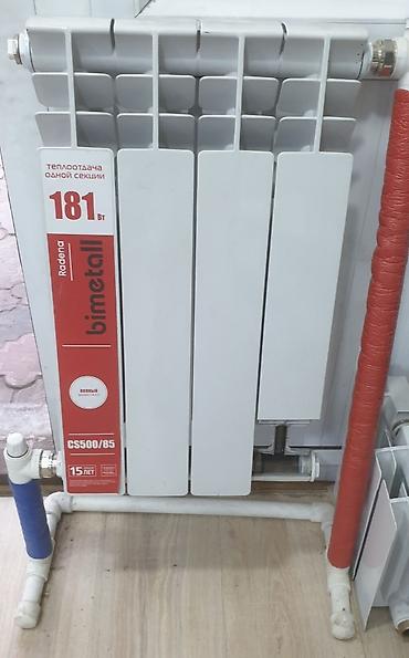 Тепловые завесы: Алюминиевый радиатор отопления белого цвета. Состоит из нескольких — 10