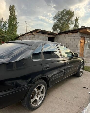 ветровик гольф 3: Toyota Carina E: 1997 г., 1.8 л, Механика, Бензин, Хэтчбэк