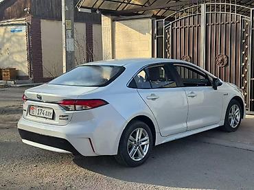 byd e2: Toyota Corolla: 2021 г., 1.8 л, Вариатор, Гибрид, Седан — 10