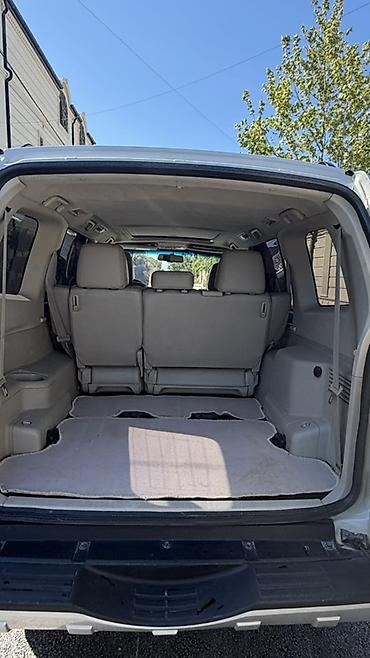 pajero mini: Mitsubishi Pajero (IV nəsil) – ağ rəngli, tam ölçülü 4x4 SUV. Əsas — 10