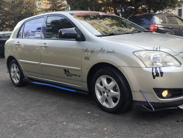 Toyota: Toyota Corolla hatchback (E12) – dizel, turbo yazılı stikerlərlə — 2