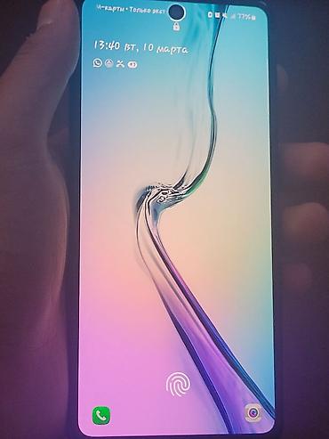 Другие мобильные телефоны: Смартфон с безрамочным дисплеем и фронтальной камерой в круглой выемке — 1