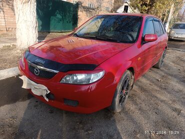 тесла автомобил: Mazda 323: 2000 г., 1.6 л, Автомат, Бензин