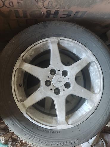 revo: Комплект автомобильных колес с шинами Bridgestone Blizzak Revo GZ на — 1