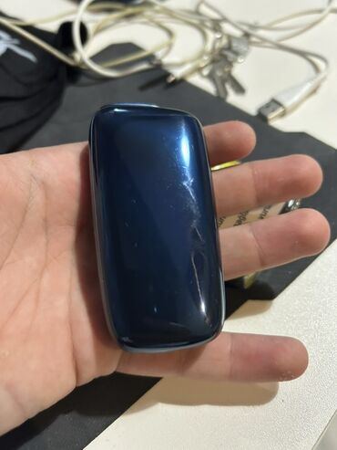 Digər: Ploom tütün qızdırıcı cihazı, yığcam forması və tünd göy rəngi ilə