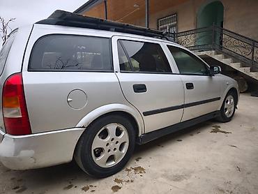 Opel: Opel Astra Caravan (universal) – gümüş rəngli kuzov, 5 qapı, dam — 2