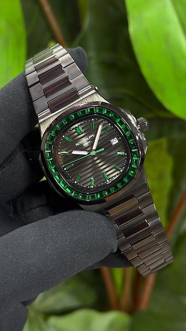 dirnaq modelleri adlari: Patek Philippe Nautilus tərzində lüks qol saatı – yaşıl daşlı bezel və — 1