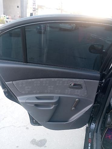 yan güzgülər s: Kia Rio: 1.4 l | 2010 il Sedan — 4