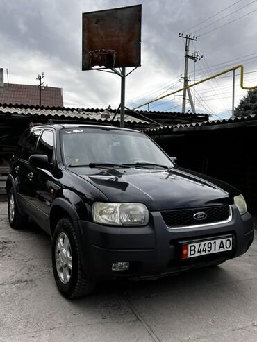 форд транзит бортовой бу в бишкеке: Черный внедорожник Ford maverick с характерным дизайном, включающим