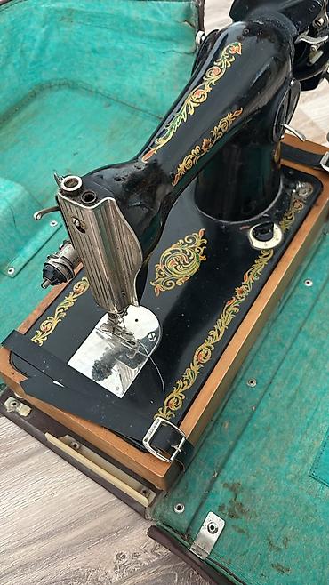 golf masini: Portativ mexaniki tikiş maşını – qolu ilə fırladılan model - Korpus — 1