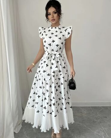Gündəlik donlar: Ağ rəngdə, qara çiçək naxışlı, uzunqol qadın midi donu. Donun V — 15