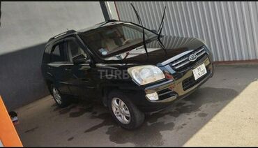 Kia: Kia Sportage – qara rəngli kompakt SUV Xarici: - Qara kuzov, 5 qapı - — 3