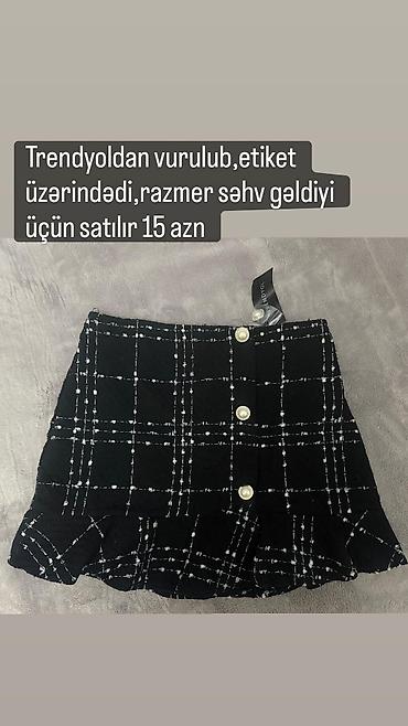macbook canta: - Qara-ağ dama naxışlı ətək. Ön hissədə düyməli dizayn, alt hissədə — 1