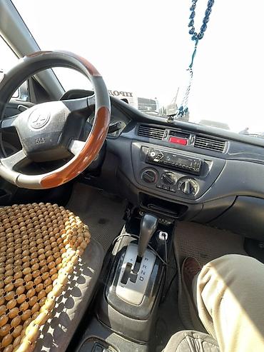 сузуки лиано: Mitsubishi Lancer: 2004 г., Автомат, Бензин, Седан — 5