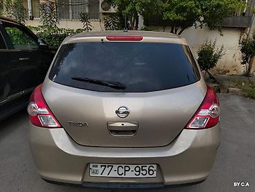 vectra stop: Nissan Tiida – hetçbek - Kuzov: 5 qapılı hetçbek, qızılı rəng - — 2