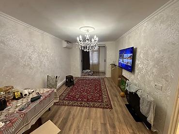 ev menzil: Satilir 5 mertebeli binanin 2 mertebesi 3 otaqli yeni temirli menzil — 4