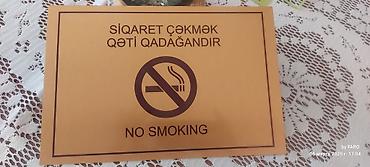 reklam tablosu: "Siqaret çəkmək qadağandır - No smoking" yazılı xəbərdarlıq tablosu — 2