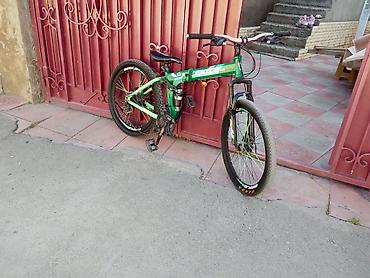 amortizator velosiped: Yaşıl rəngli BMX tipli velosiped. Xüsusiyyətlər: - BMX üslublu — 1