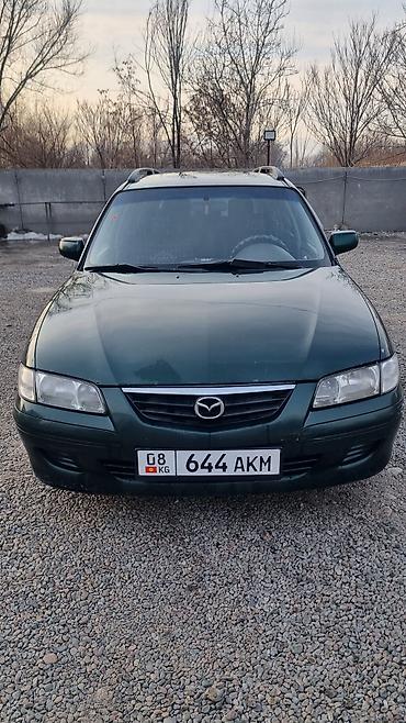 козырек 124: Mazda Capella: 2000 г., 2 л, Механика, Бензин, Универсал — 1