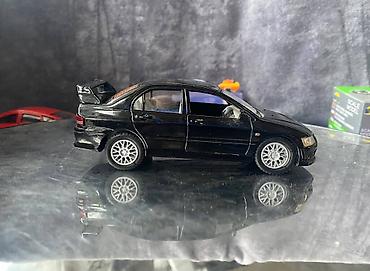Avtomobil modelləri: Коллекционная модель Mitsubishi Lancer Evolution VII black 2002 — 6
