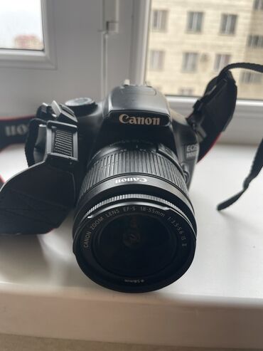 Фотоаппараты: Зеркальный фотоаппарат Canon EOS 1100D с объективом Canon Zoom Lens