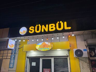 İstehsal avadanlığı: Bu, “Sünbül” adlı bir mağazanın lövhəsidir. Lövhədə sarı rəngli