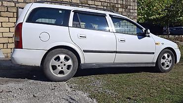 avtomobil kreditlə: Opel Astra Caravan (Universal) – ağ rəngdə, 5 qapı Mühərrik və — 4