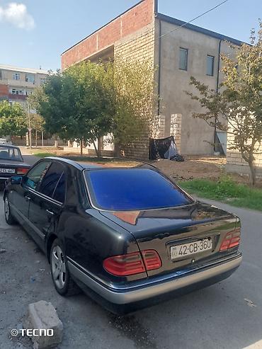 Mercedes-Benz: Mercedes-Benz E-Class: 2.3 l | 1995 il Sedan — 3