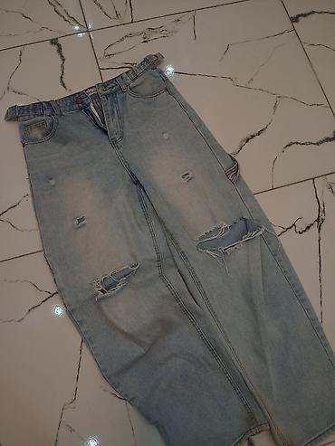 Kişi geyimləri: Məhsul: Açıq mavi rəngdə cins şalvar - Kəsim: Geniş/relaxed fit, düz — 1