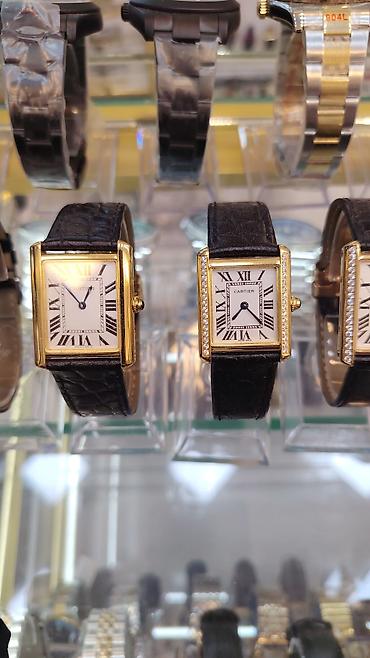 smar saat: Cartier Tank seriyası qol saatları - Korpus: düzbucaqlı forma, qızılı — 1