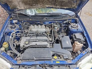 mazda 2000: Mazda 323: 2002 г., 1.6 л, Механика, Бензин, Хэтчбэк — 4