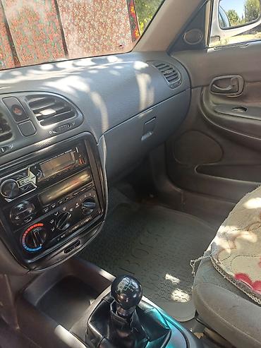 седло на даф: Daewoo Nubira: 1997 г., Механика, Седан — 5